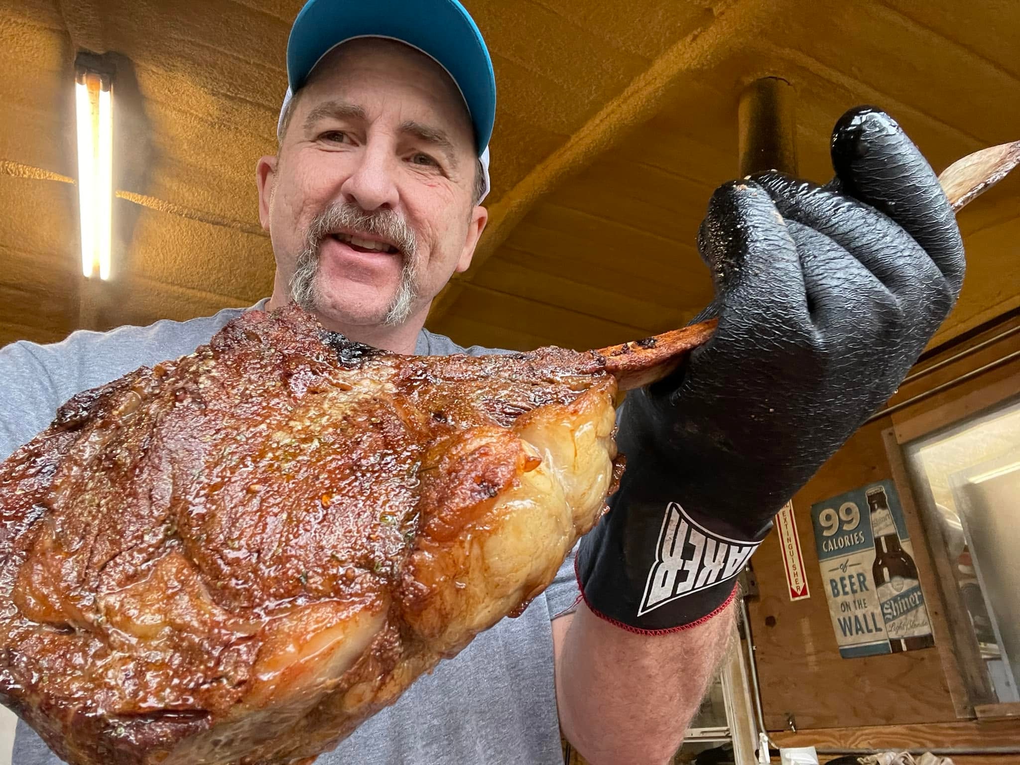 Pitmaster tending the smoker at The Rusty Buckle